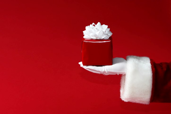 santa holding gift getty images