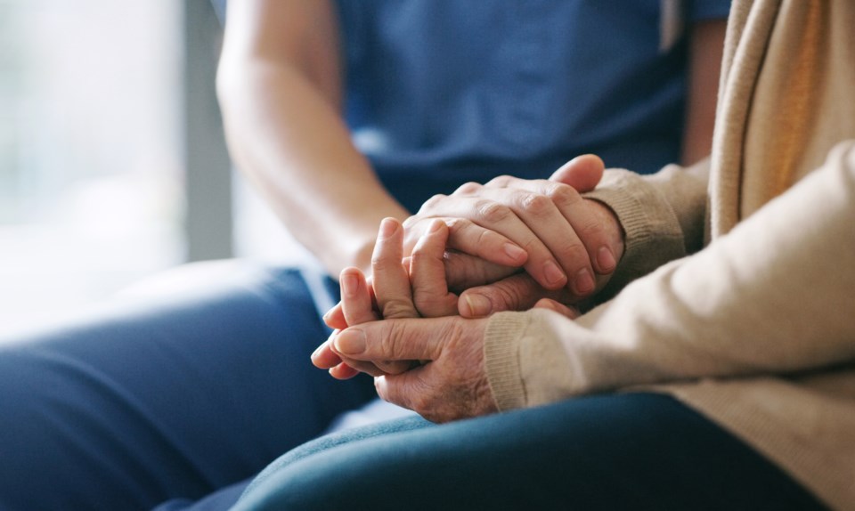 senior-visit-hand-holding