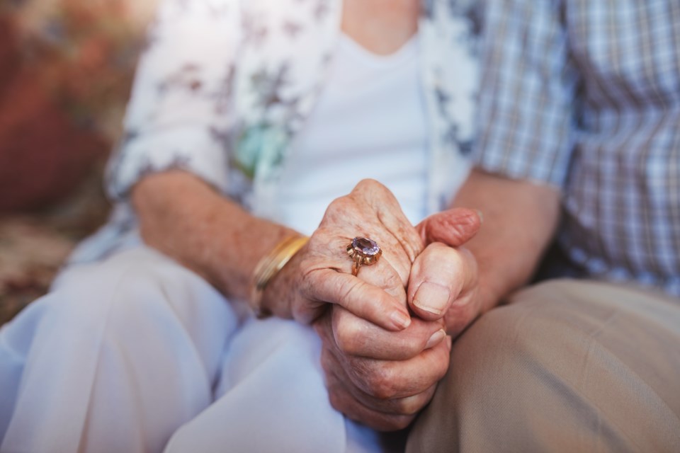 seniors holding hands