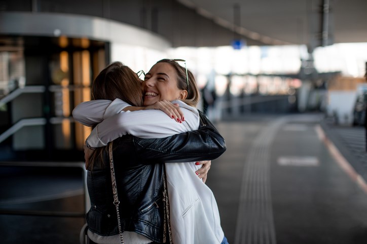 two people hugging getty images