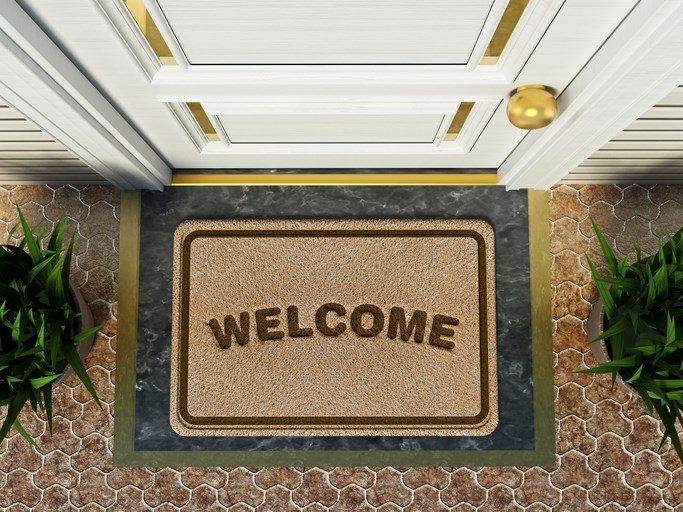 welcome mat outside door getty images