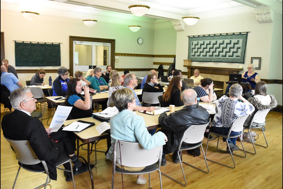 Patrons to the Palliser Regional Library annual general meeting listen to director Jan Smith’s presentation at the start of the event.