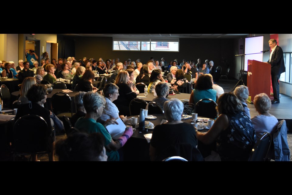 Festival of Words participants listen to astronaut Dr. David Williams read a passage from his book Defying Limits.