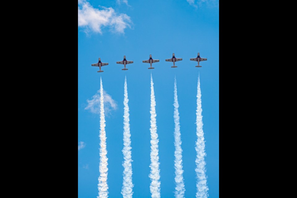 Five Royal Canadian Air Force CT-114 Tutors fly in extremely close formation during the Snowbirds' 2022 Acceptance Show on 9 June, 2022 at 15 Wing Moose Jaw, Saskatchewan.