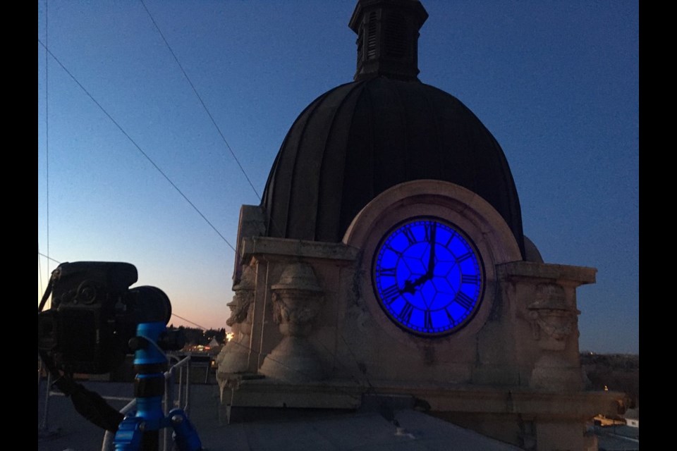 Murray Rimmer and John Trodd, who recently upgraded the clock tower and installed blue lighting, film Moose Jaw's blue-lit City Hall as part of the Canada-wide attempt at breaking the Guinness Book of World Records for the most landmarks similarly recognized at one time on the night of April 1.
