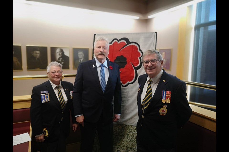 Sue Knox (left) and Bob Travale (right) presented Mayor Tolley (center) with the first poppy to kickstart the 2023 poppy campaign on Oct. 26, 2023.