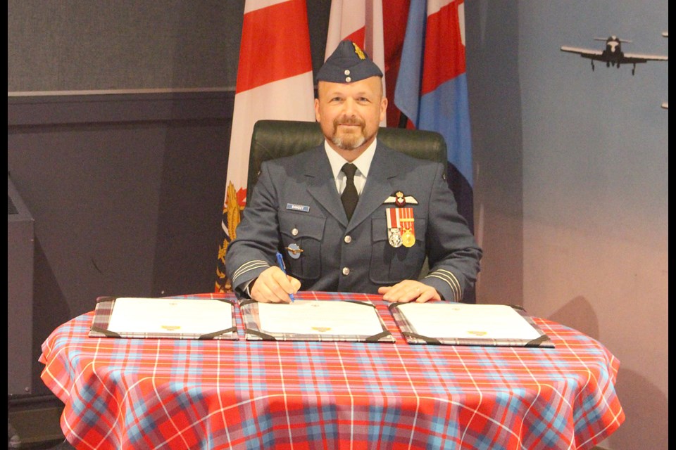 Lt. Col. Denis Bandet signs on as the new Snowbirds commanding officer.