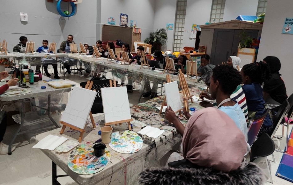 Newcomers participate in the Nov. 27 art workshop led by Muveddet Al-Katib.