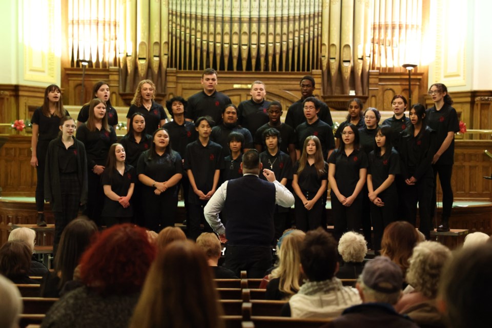 Vanier Collegiate Choir performing with their director David Selensky