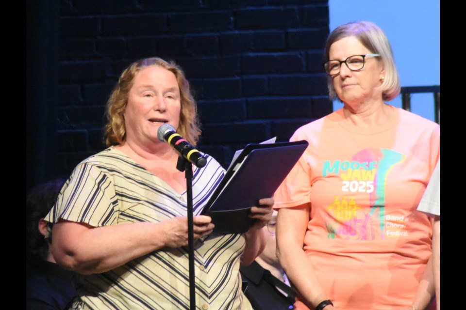 Suzanne Gorman, CEO of the Saskatchewan Band Association (left), discusses why organizers of the Moose Jaw Band and Choral Festival were receiving a national award. Janie Fries, festival chairwoman, stands beside Gorman. Photo by Jason G. Antonio