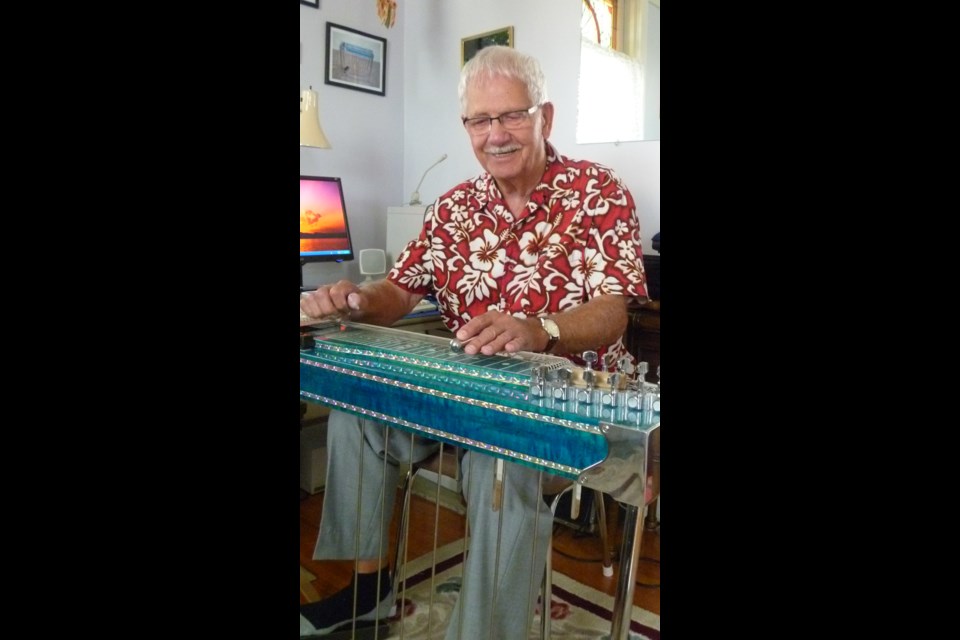 Tex Emery playing his 12 string steel guitar in 2010