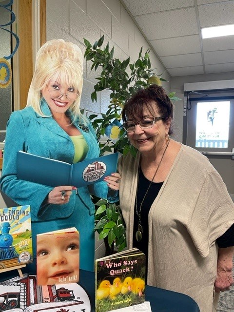 christine-boyczuk-poses-with-a-dolly-parton-cutout-at-the-moose-jaw-early-years-family-resource-centre