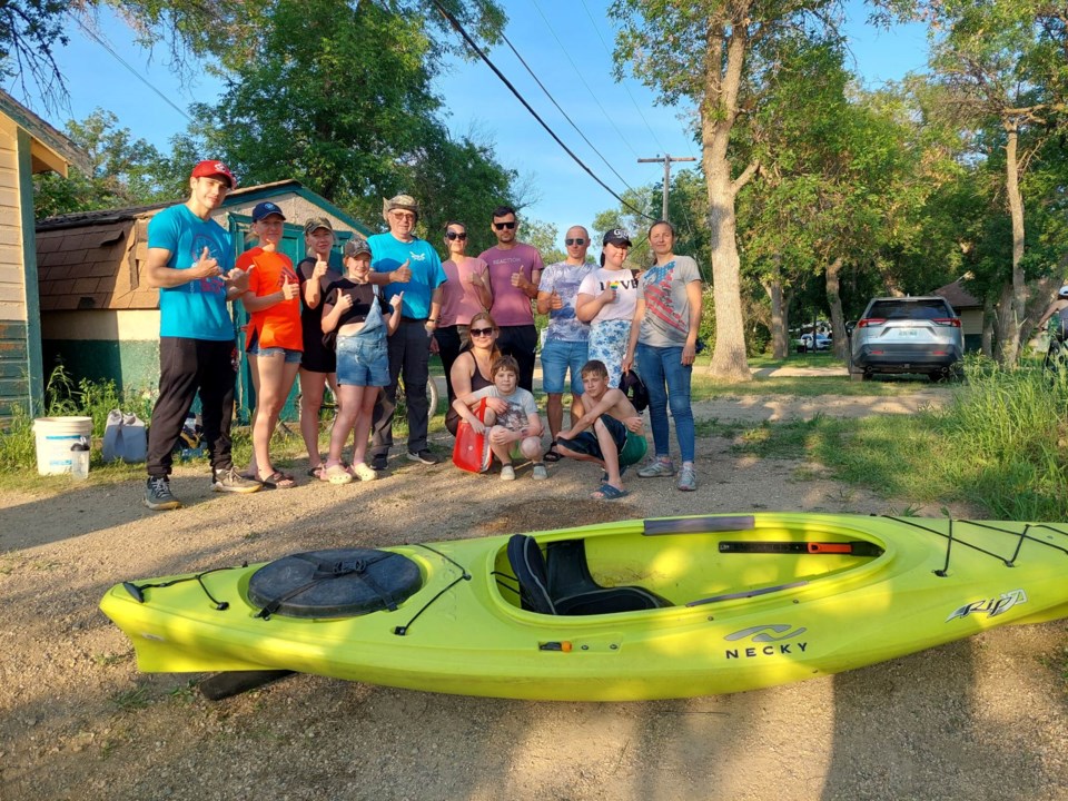 mj-canoe-and-kayak-club-with-a-group-of-resettled-ukrainians-who-dipped-their-toes-into-the-moose-jaw-river-on-june-11