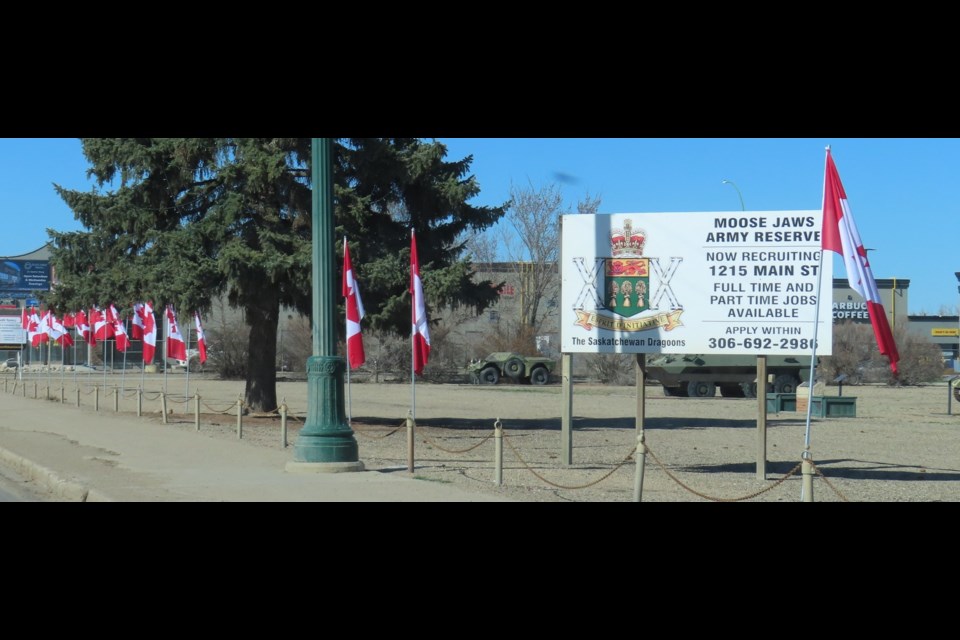 A row of Canadian flags on Main Street North in front of the Armoury building. Photo submitted