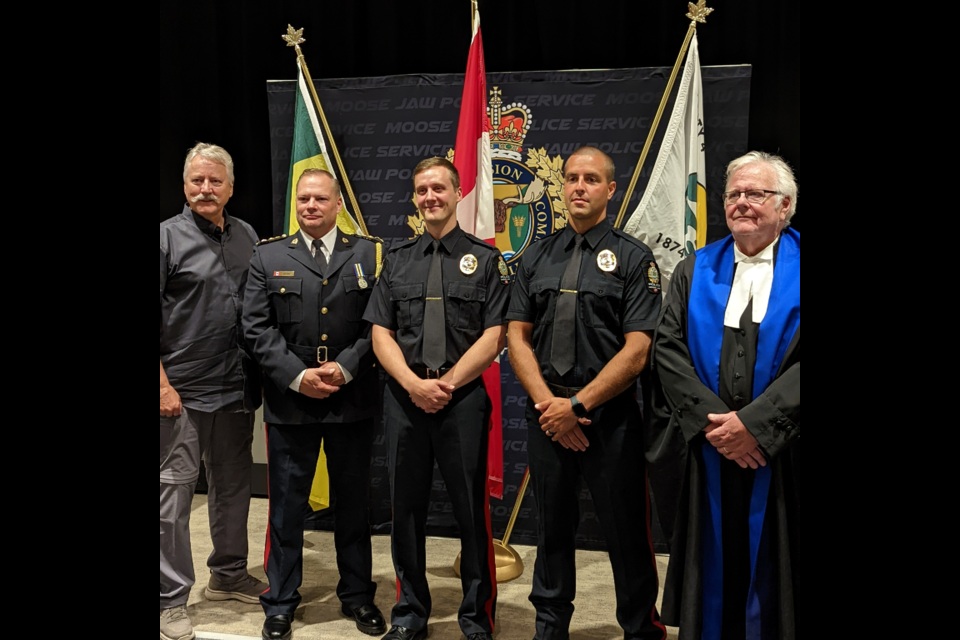 (l-r) Mayor Clive Tolley, Deputy Chief of Police Rick Johns, Cst. Eric Roncin, Cst. Riley Holzapfel, Provincial Court Judge Brian Hendrickson