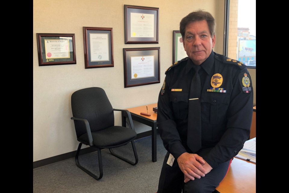 Police Chief Rick Bourassa poses in his office on the second floor of police headquarters. Photo by Jason G. Antonio 