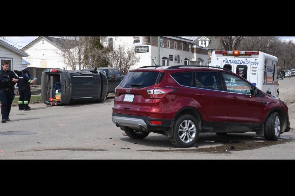 A red SUV and a grey-blue minivan involved in the collision. Photo by Jason G. Antonio