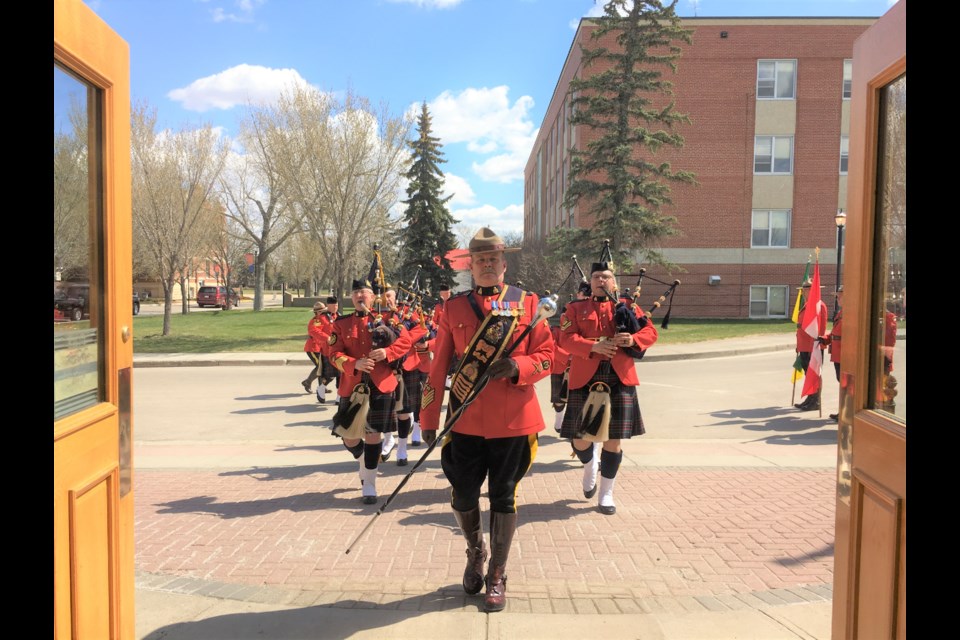 The pipes and drums prepare to march into the Drill Hall at the RCMP Academy in Regina before the change in command ceremony begins. Photo contributed