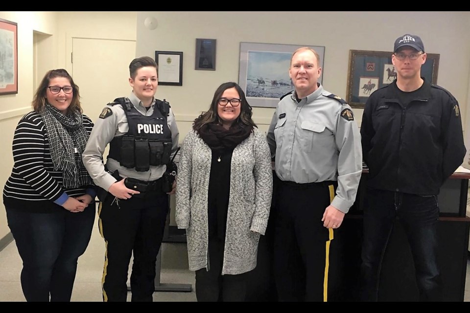  Caption: John Howard Society’s Crime Prevention Facilitator Delaney Girodat (middle) alongside Sgt. Tim Schwartz and his team at the Moose Jaw RCMP Detachment. (Submitted photo).