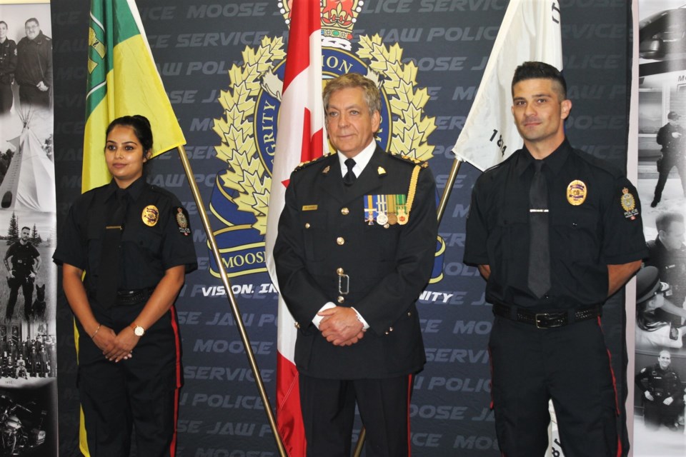 Constable Anureet Kaur (L), Chief Rick Bourassa (C) and Constable Cesar Suarez (R) of the Moose Jaw Police Service.
