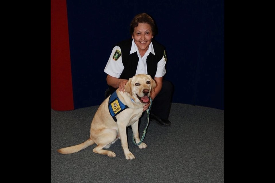 Donna Blondeau, the former Victim Services Unit co-ordinator, and facilities/trauma dog Kane, pose for a picture circa 2015. Photo courtesy Facebook