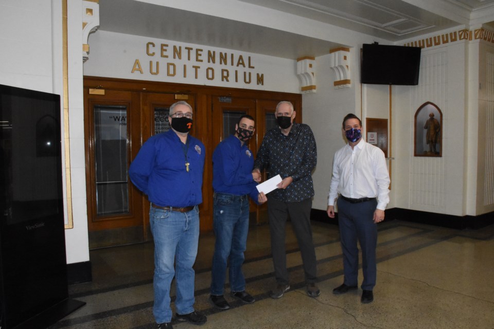 L-R: Moose Jaw ACT/UCT president Mark Gilliland and youth representative Sebasten Halvorsen presents a cheque to chairman Lyle Johnson, with A.E. Peacock Collegiate principal Dustin Swanson present as the ACT offered support for renovations to Peacock’s Centennial Auditorium. 