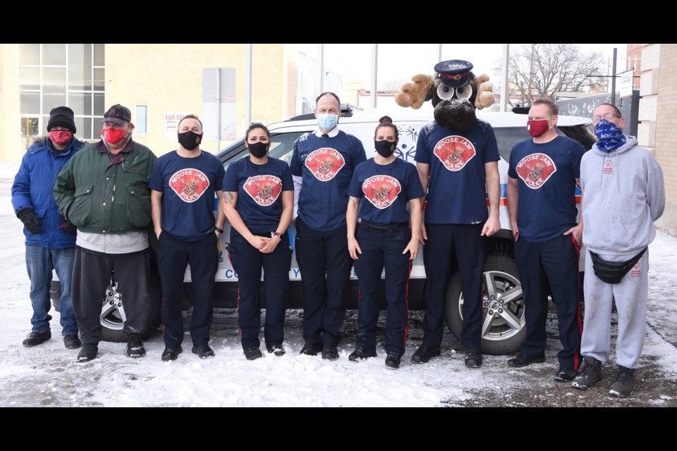 Members of Moose Jaw Special Olympics and the Moose Jaw Police Service pose for a picture before the start of the Polar Plunge on March 1. Photo courtesy MJPS Facebook