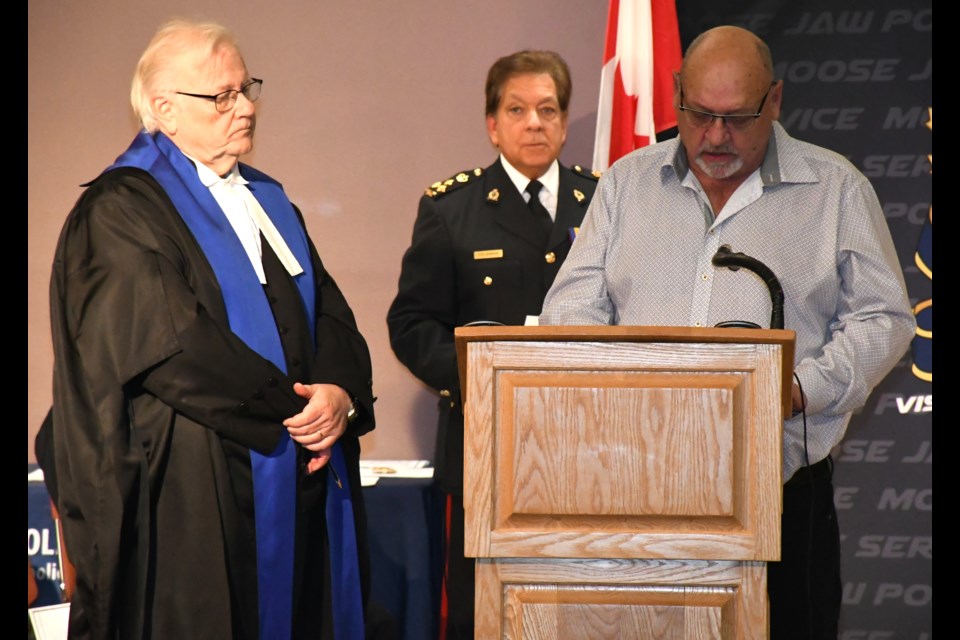 Judge Brian Hendrickson listens to Doug Blanc affirm his oath of office as a police commissioner. Photo by Jason G. Antonio