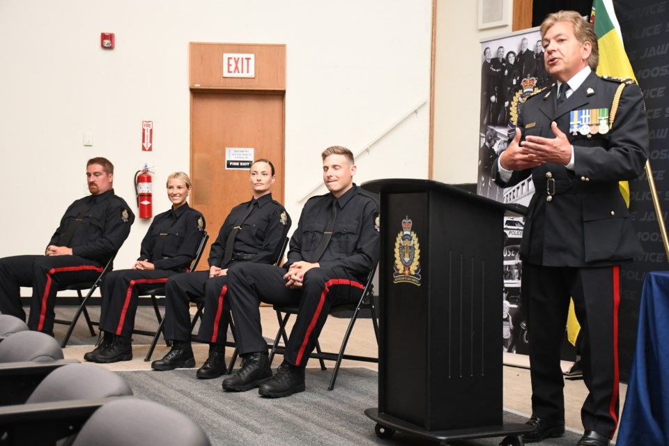 Police Chief Rick Bourassa (right) speaks to the crowd at the start of the swearing-in ceremony. Photo by Jason G. Antonio 