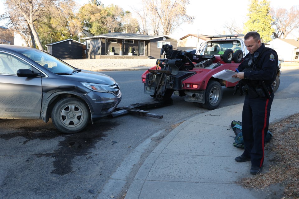 Const. Kyle Cunningham taking notes of the accident. Photo by Saddman Zaman