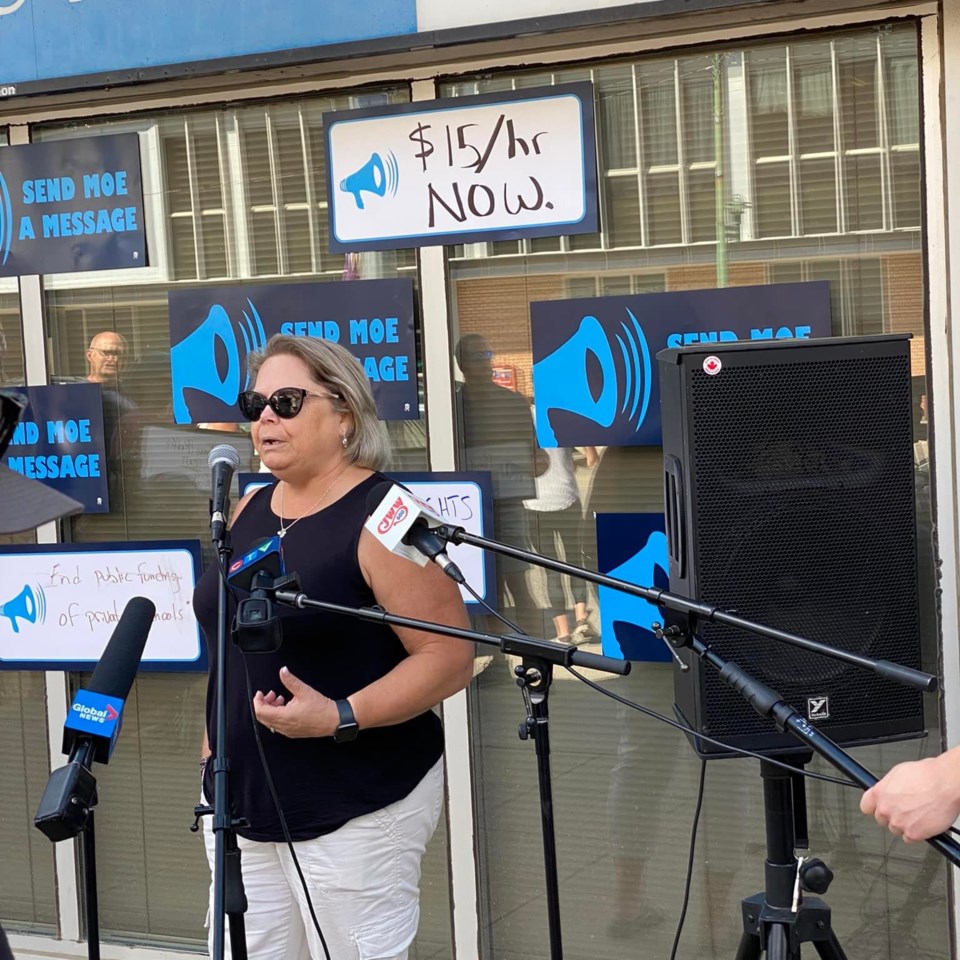 Lori Johb speaks at an SFL rally in Saskatoon