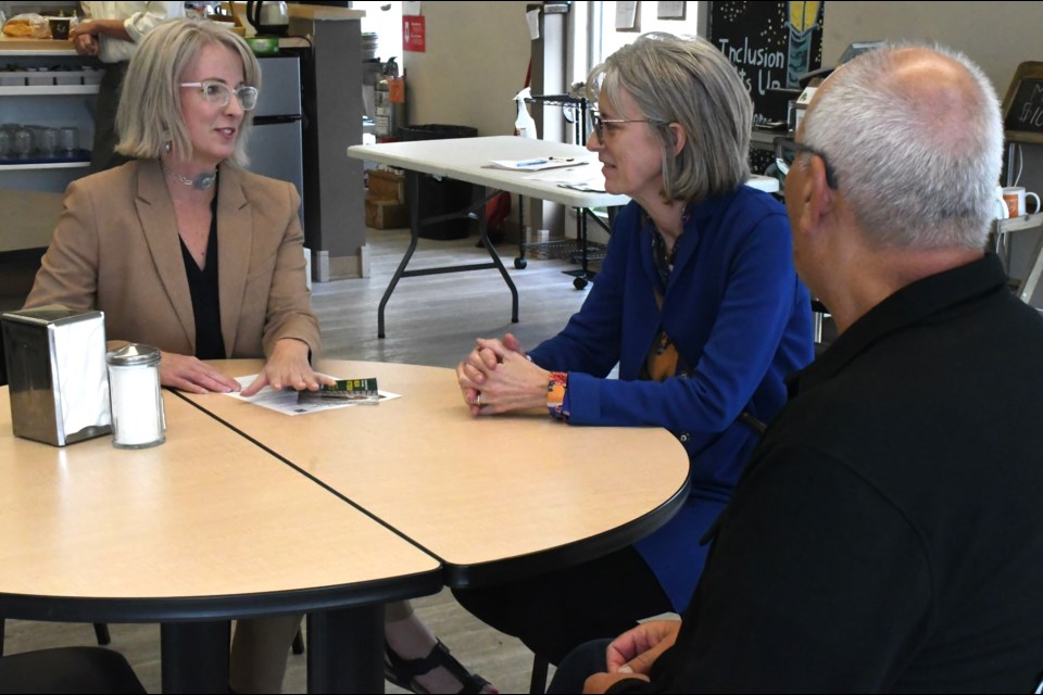 Megan Patterson, who wants to secure the Sask. Party nomination in Moose Jaw Wakamow, speaks with Carol and Carson Chute during a meet and greet on South Hill. Photo by Jason G. Antonio