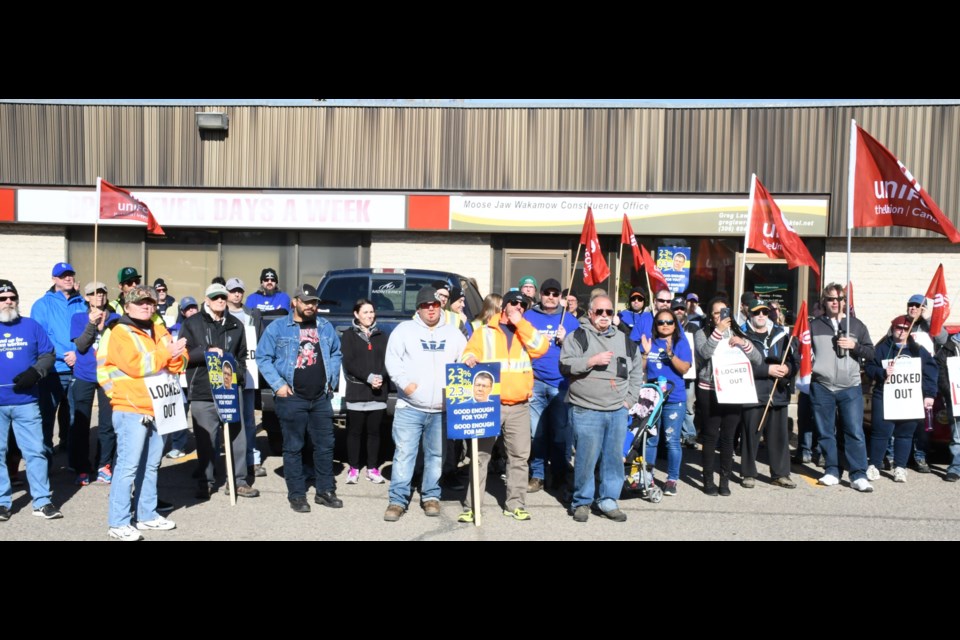 Nearly 60 Unifor union members gather in front of MLA Greg Lawrence's office on Oct. 16 during a lunchtime protest. Photo by Jason G. Antonio