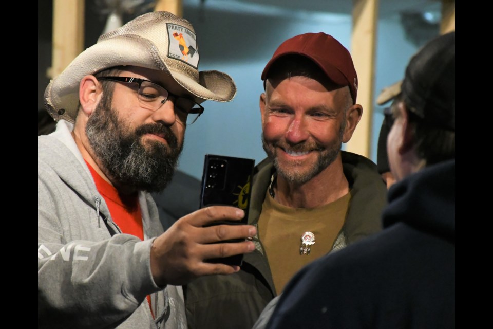 Military veteran James Topp (right) poses for a picture during a freedom rally at Prairie Storm Paintball on April 18. Photo by Jason G. Antonio 