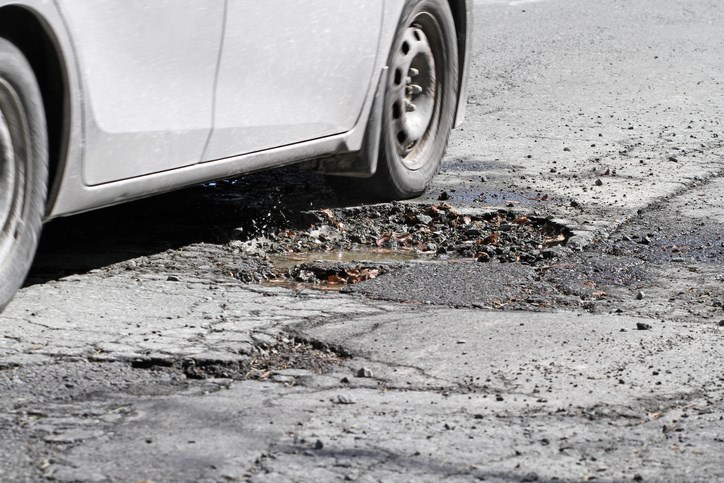 driving through pothole getty images