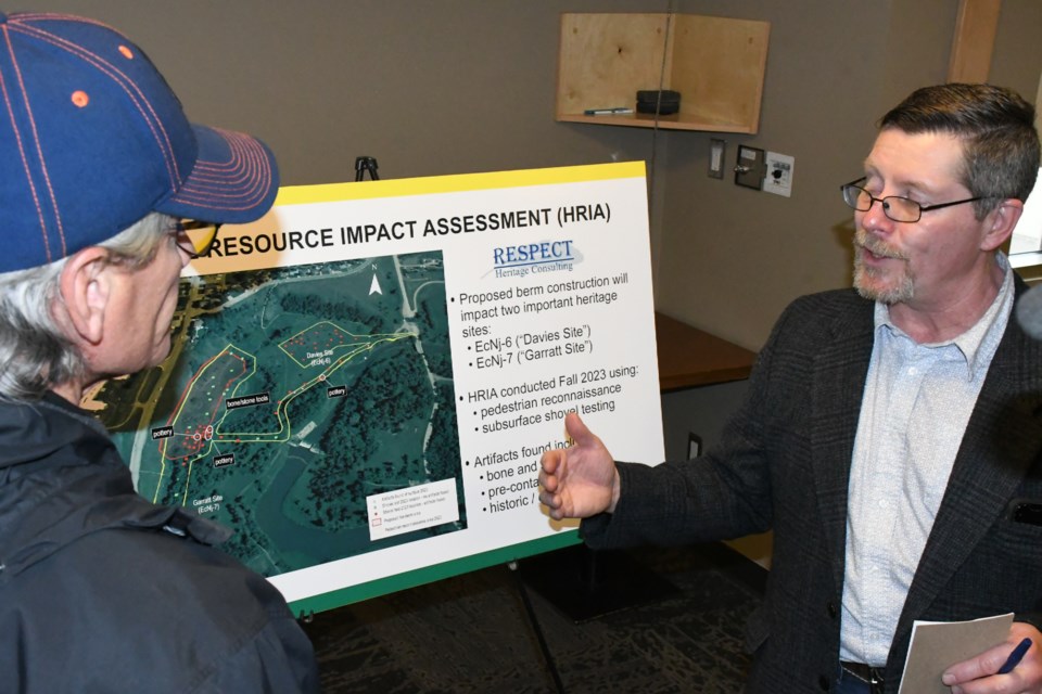 Alan Korejbo, a registered professional archaeologist with Respect Inc. Heritage Consulting (right), speaks about the artifacts he found on the sites near proposed construction in the valley. Photo by Jason G. Antonio