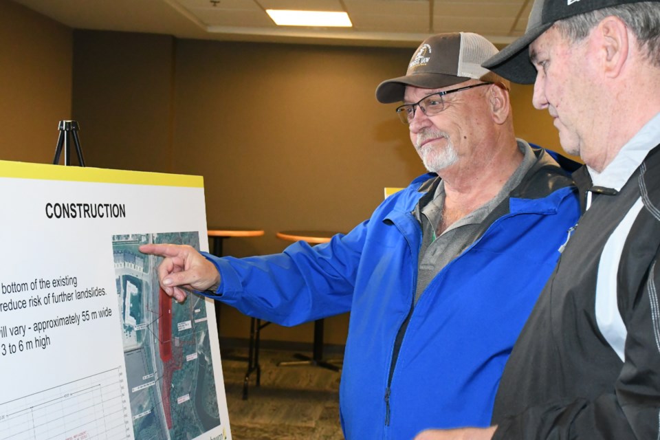 Coun. Doug Blanc and another visitor view some of the details of the project. Photo by Jason G. Antonio