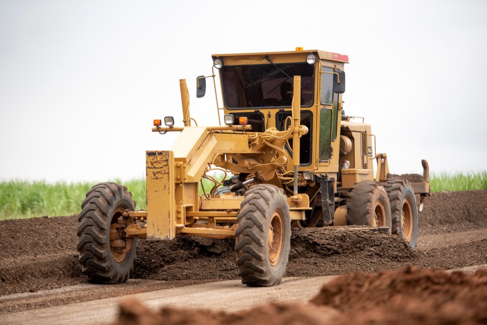 public-works-road-grader-on-a-rural-road-jung-getty-moment-getty-images