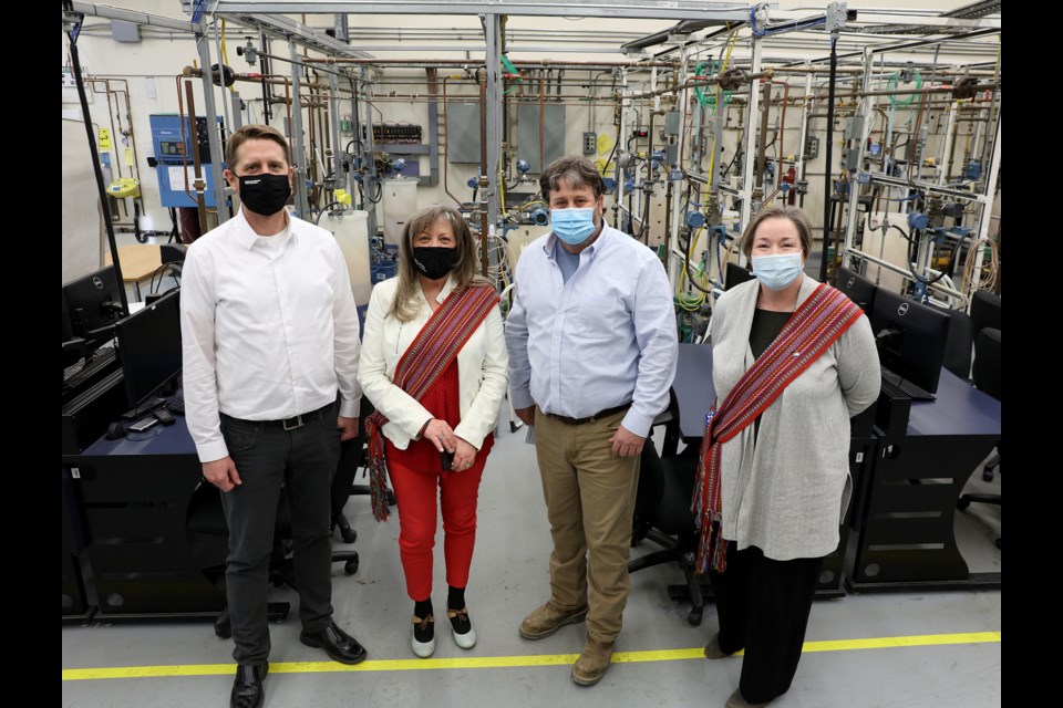 Dan Bechard, academic chair of the School of Natural Resources and Built Environment; Rosemarie Zaba Stewart, Indigenous student advisor; Brad Butcher, project manager for the Great Plains Power Station construction site; and Marlene Dormuth, Indigenous students’ centre coordinator, in Sask Polytech's instrumentation lab