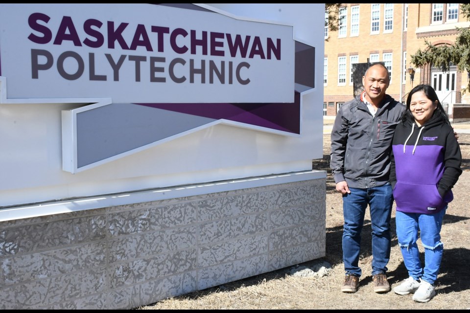 Carlito and Liezl Orino stand outside Saskatchewan Polytechnic's Moose Jaw campus during a break from their classes. Photo by Jason G. Antonio