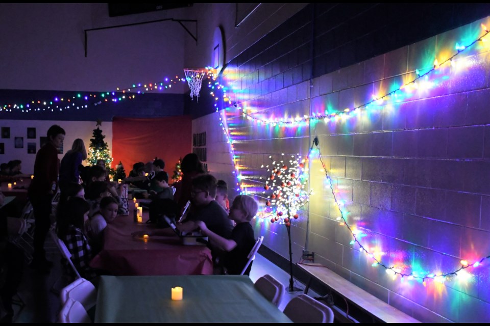 Teachers decorated the gym with Christmas lights, trees, candles and artwork. Photo by Jason G. Antonio