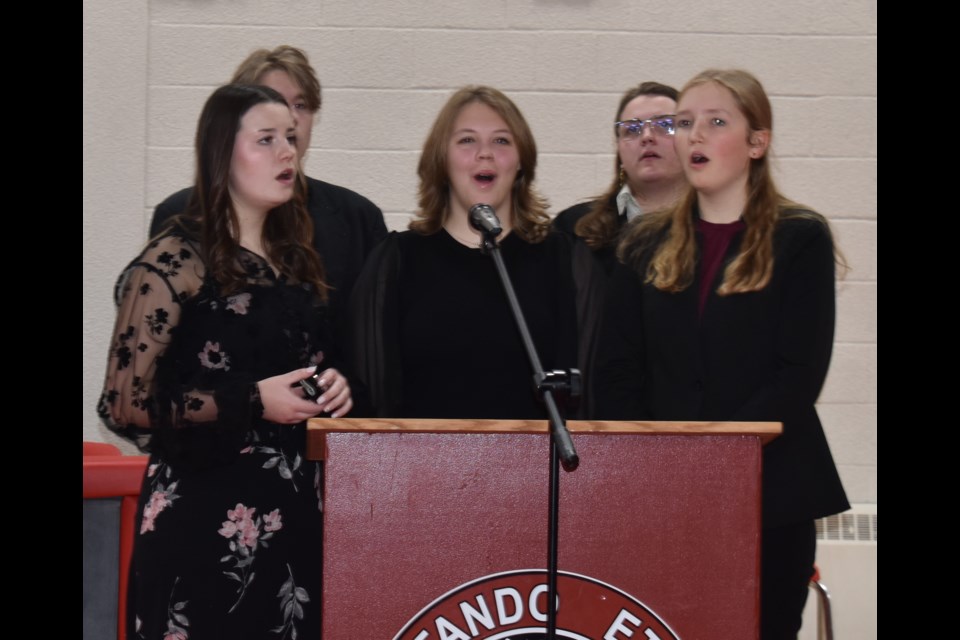 The Central Collegiate choir — composed of Presley McLeod, Isabelle Adams, Katherine Delanoy, Alex Bakkan and Luka Pollock — sing O Canada to start the ceremony. Photo submitted
