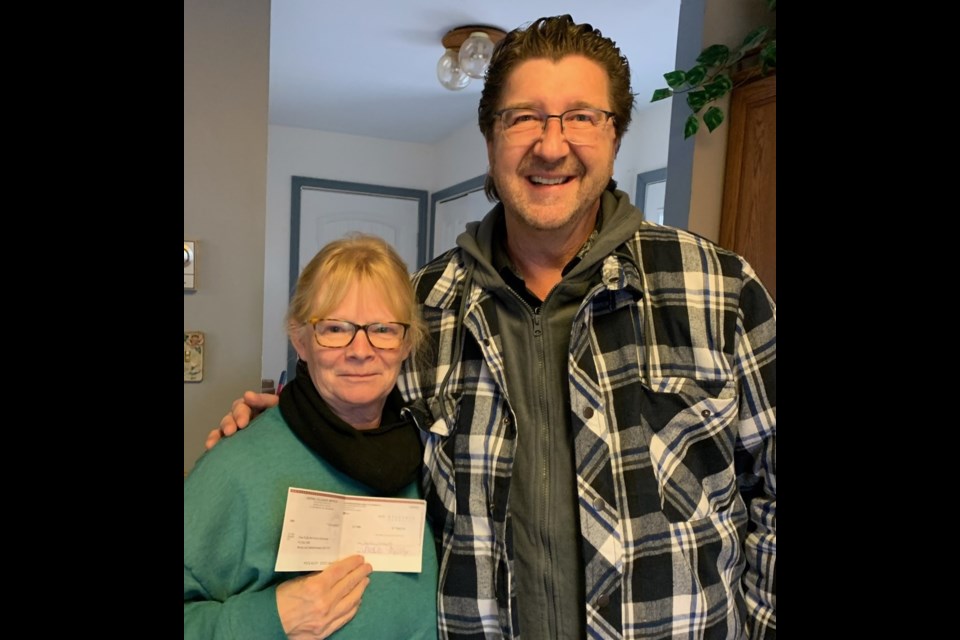 The $600 donation was received by Louanne Shropshire (left) on Dec. 8. Ray Rawlyk is on the right.