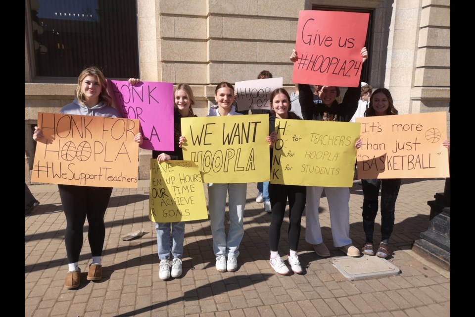 Students demonstrate in front of City Hall to fight for the continuation of Hoopla 2024 at noon on March 18.