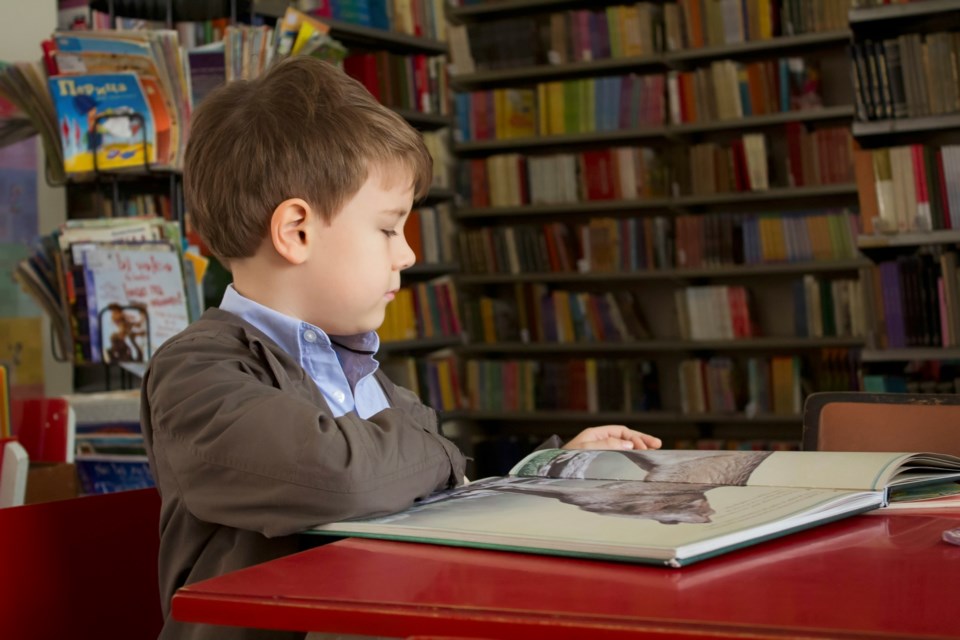 kid-reading-library-unsplash-1
