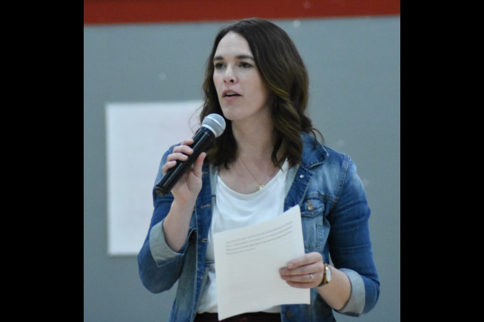 Laura Adrian, the early learning co-ordinator in Holy Trinity Catholic School Division, introduces New Zealand-based educator Dr. Sarah Aiono to parents at Vanier Collegiate. Photo by Jason G. Antonio