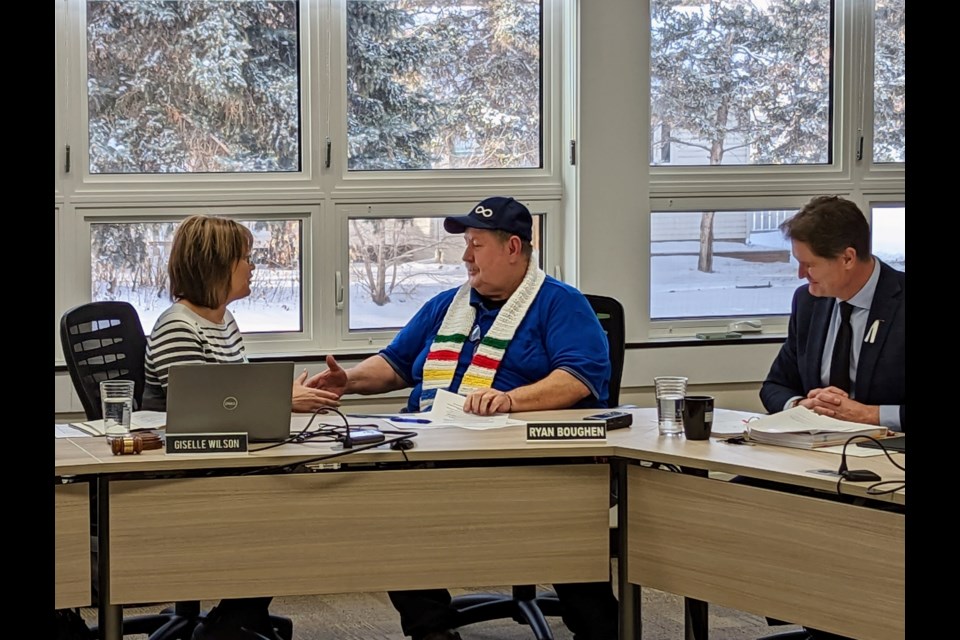 New Southern Plains Metis Local 160 President Darrell Hawman shakes hands with Giselle Wilson, chair of the PSSD board, after signing the MOU