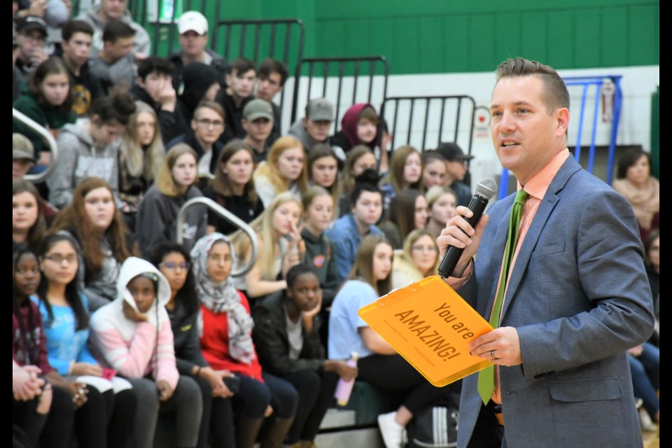 Dustin Swanson, principal of A.E. Peacock Collegiate, speaks to students at the start of the pep rally on Oct. 25, where Moose Jaw Co-op made its donation announcement. Photo by Jason G. Antonio