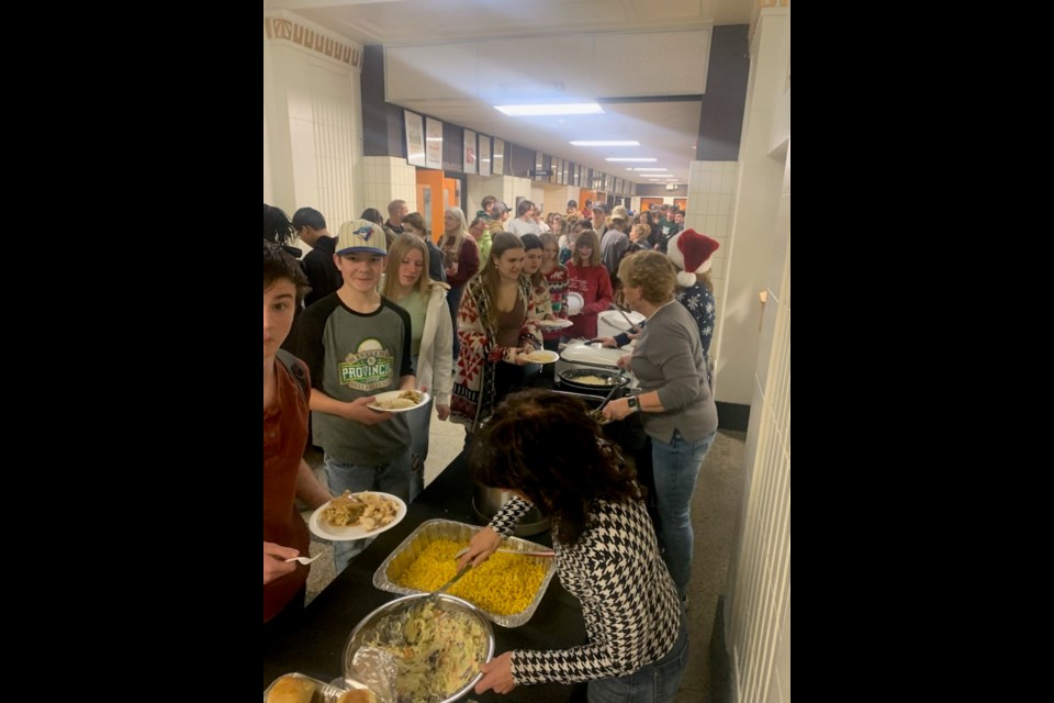 Peacock staff, students, and parents contributed to a turkey dinner feast that fed 600 on the last day before the break