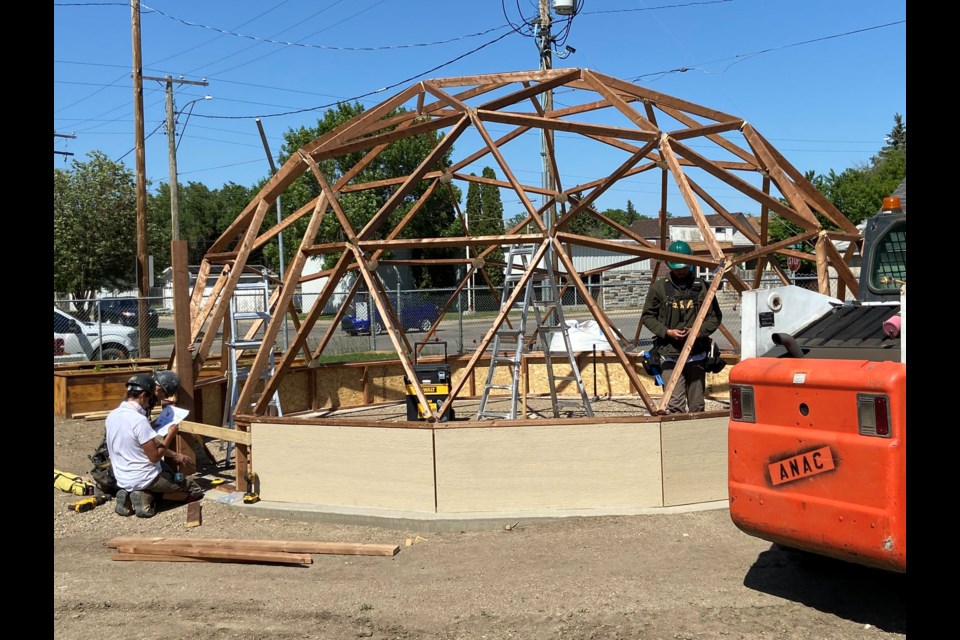 All 'n' All Construction works on building the greenhouse, which is a geodesic dome design. Photo courtesy Brad Raes